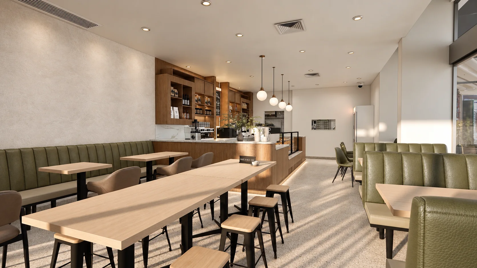 Olive banquette seating and timber tables in a café
